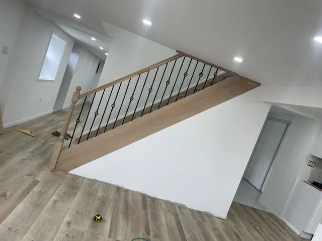 Staircase with oak treads and iron balusters