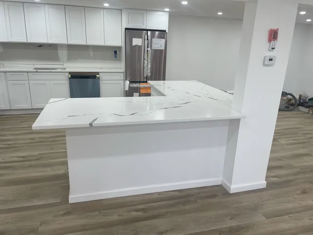 White kitchen with marble-look island
